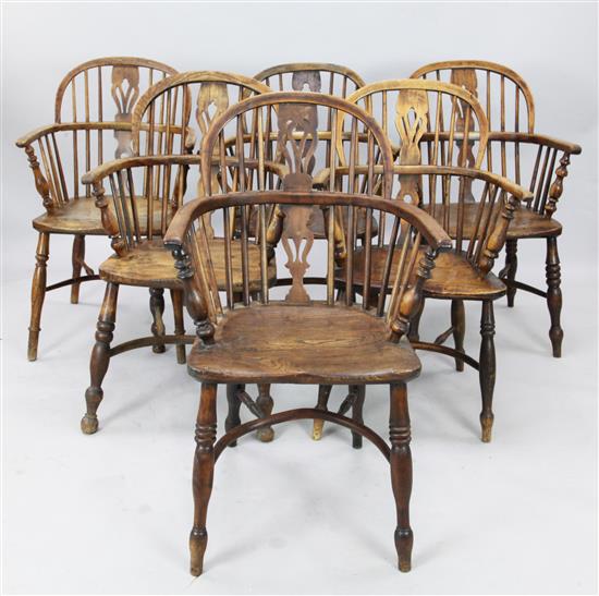 A harlequin set of six early 19th century yew wood low back Windsor chairs, tallest 3ft.